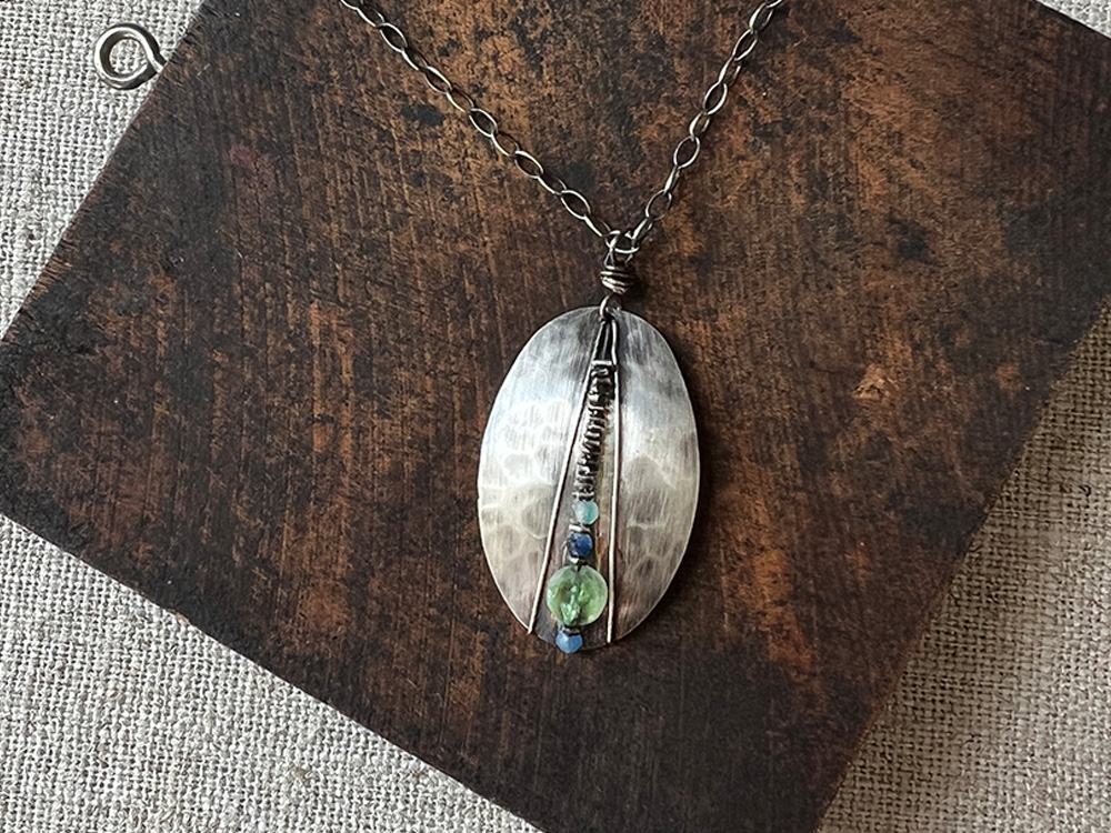 wire-wrapped shield pendant